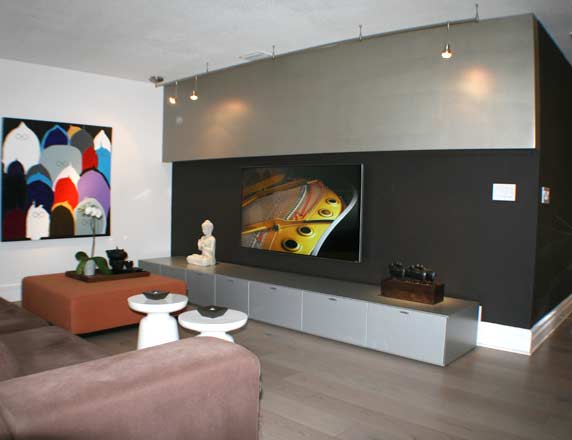 Custom entertainment wall with TV in curved modern design
