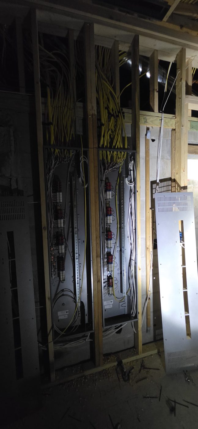 Central structured wiring panel staged during new-home construction