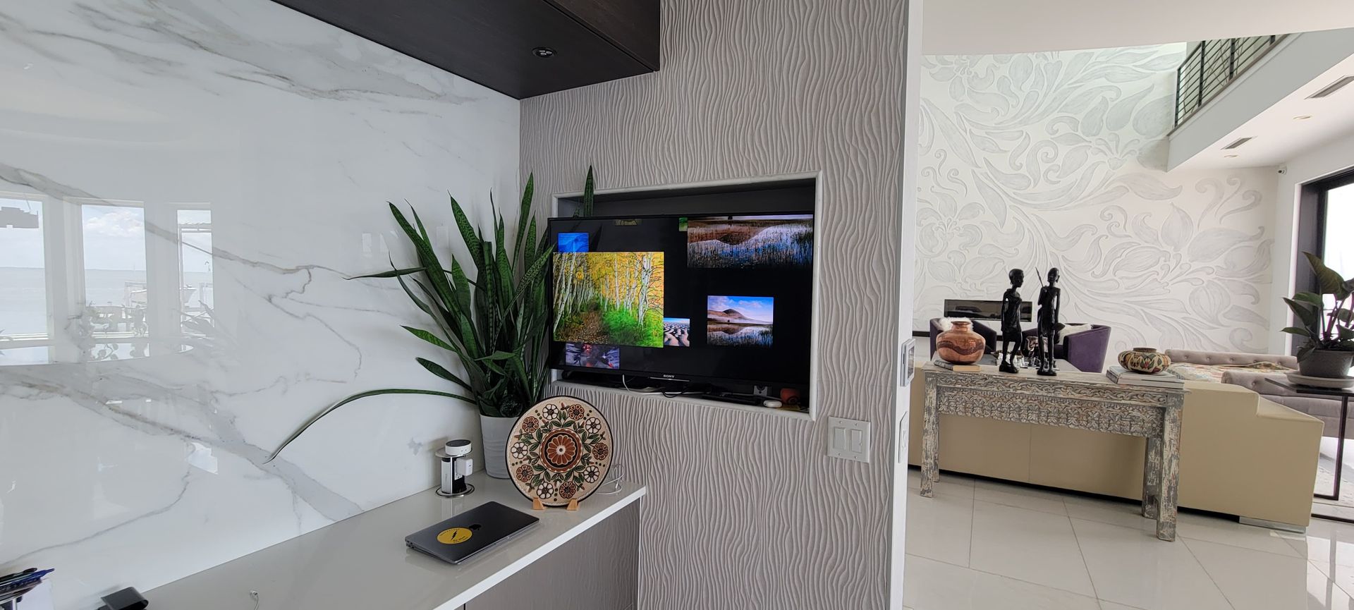 Recessed TV installation in marble wall