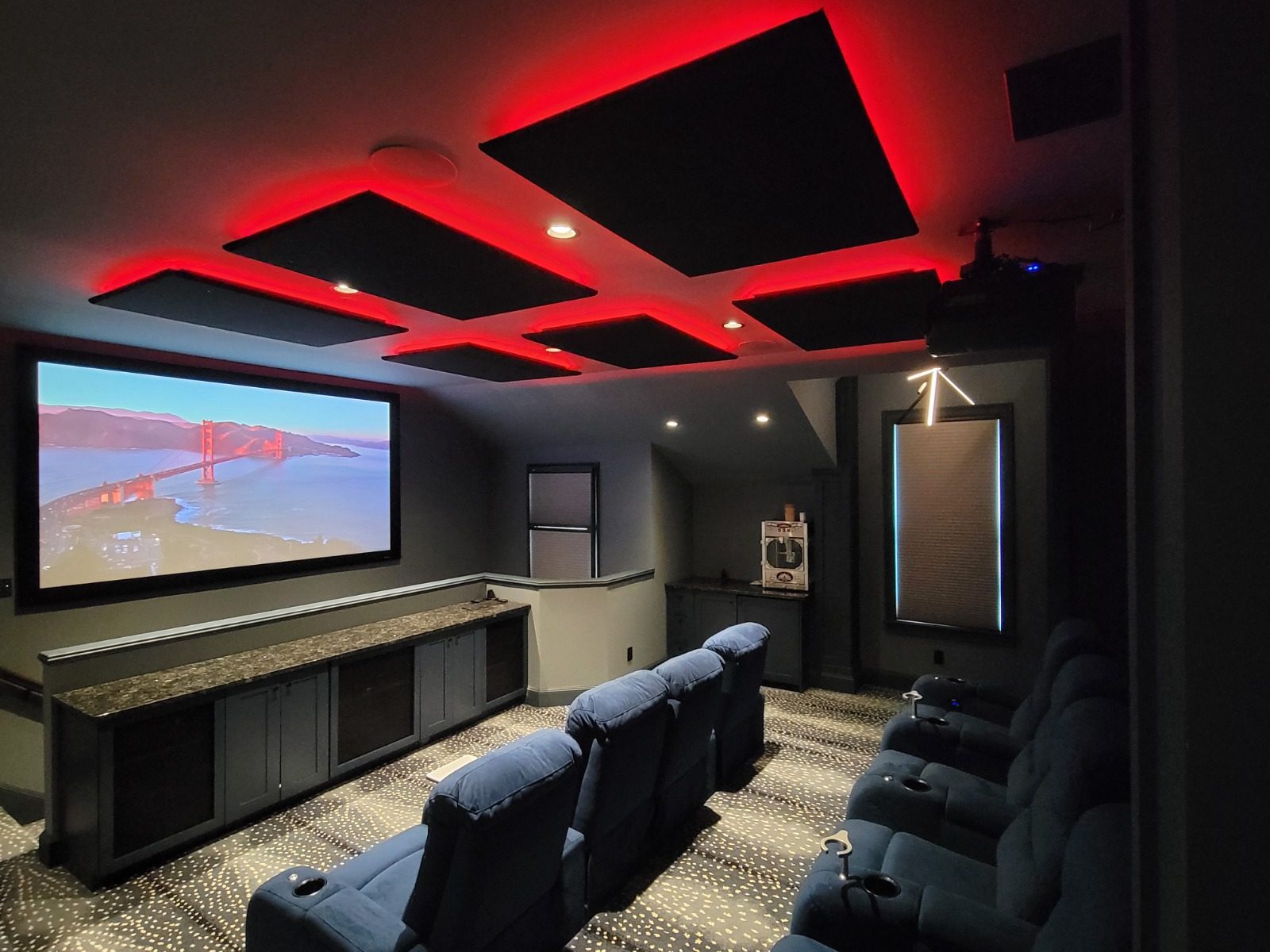 Home theater under red LED lighting with cinematic projection