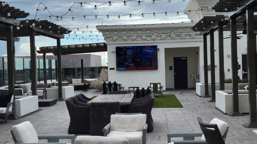 Rooftop amenity deck lounge seating and TV